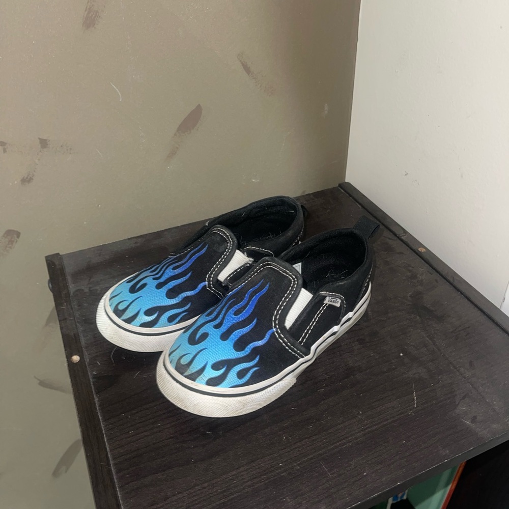 Vans Kids Black Slip-On Sneakers with Blue Flames